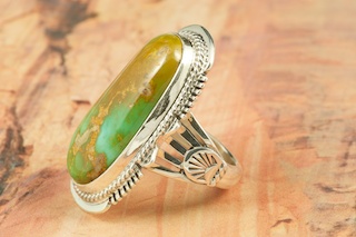 Genuine Crow Springs Turquoise set in Sterling Silver Ring. The Crow Springs Mine is located near Tonopah, Nevada. Created by Navajo Artist John Nelson. Signed.
